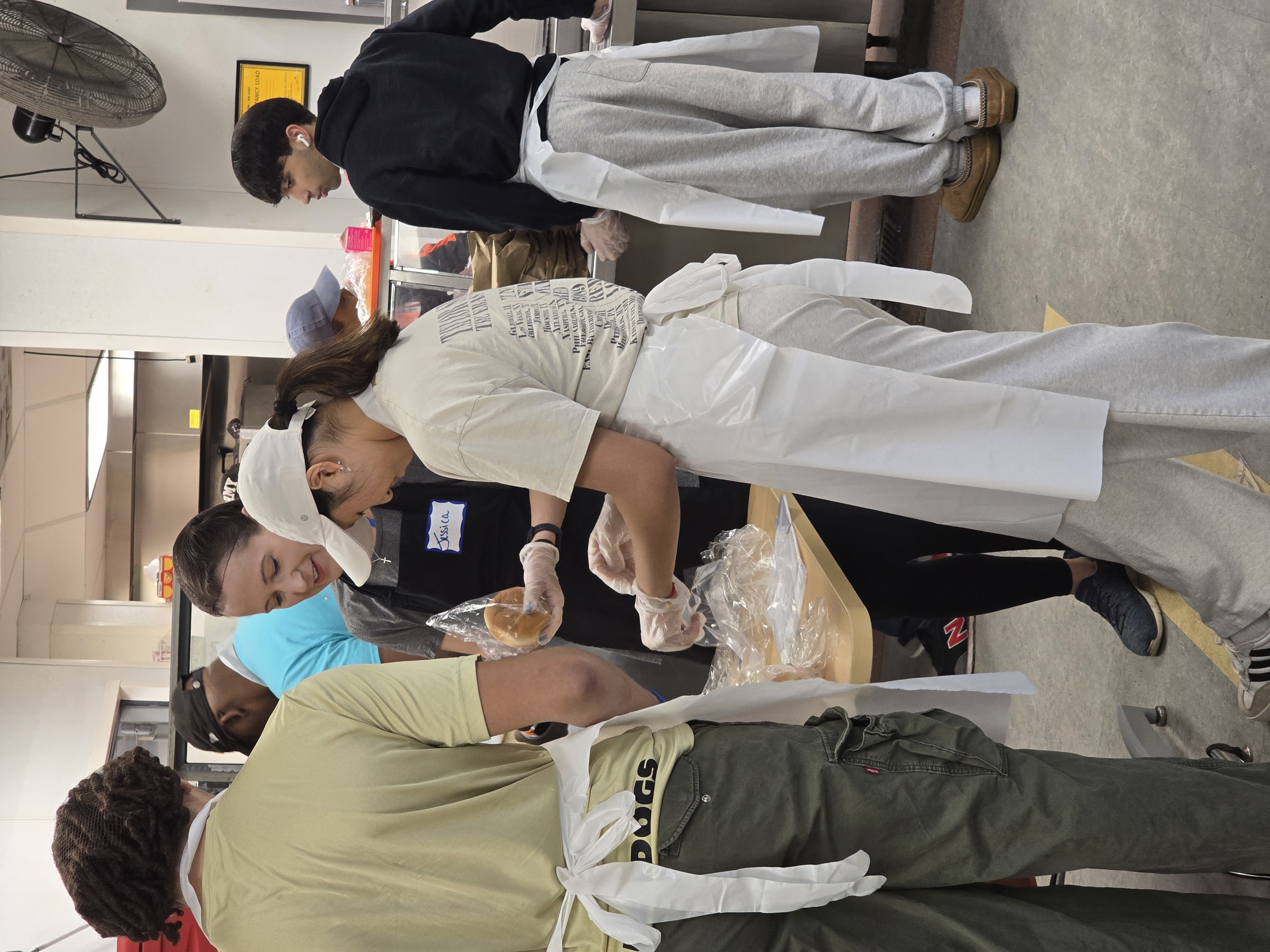 Volunteers wrapping baked goods